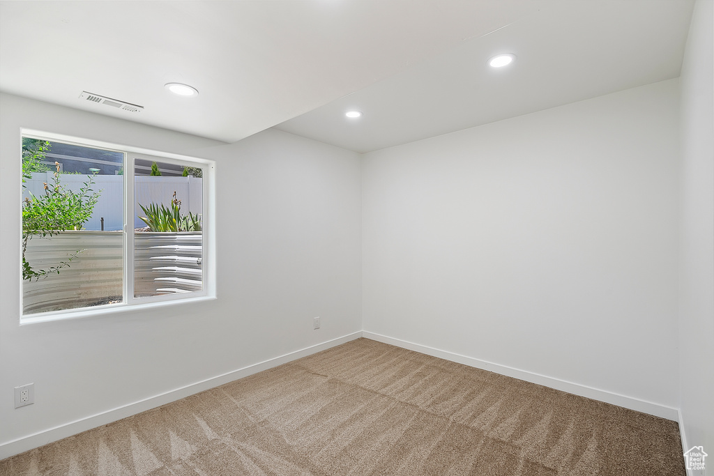 Unfurnished room with carpet flooring and recessed lighting