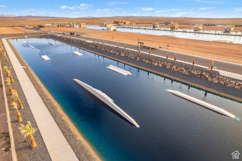 View of pool featuring a water and mountain view