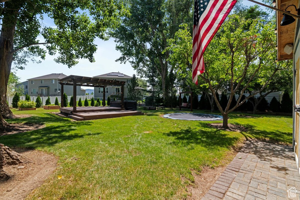 View of yard featuring a wooden deck