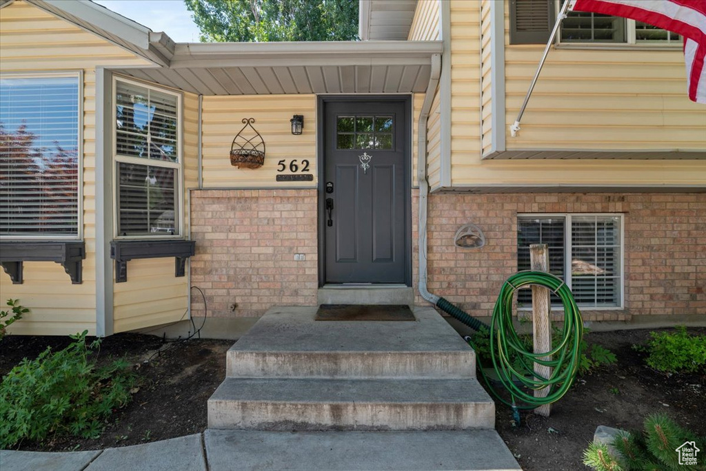 Property entrance with brick siding