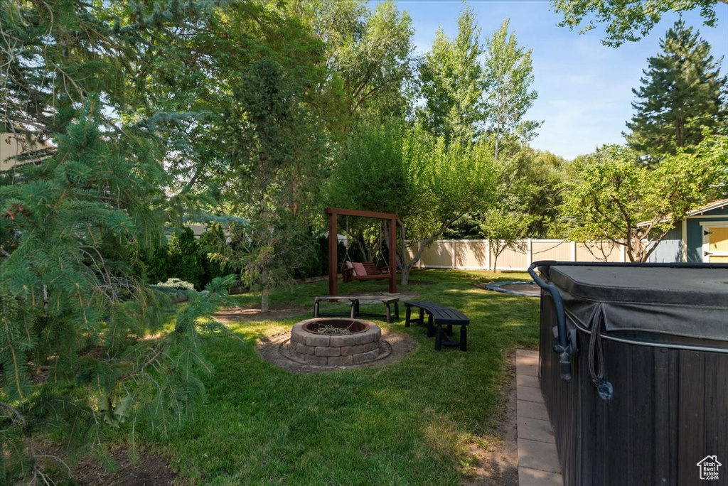 View of yard with an outdoor fire pit