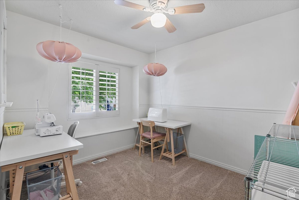Office with carpet and ceiling fan