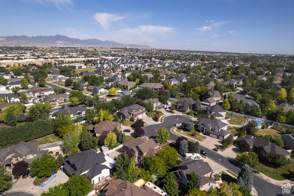 Aerial overview of property\'s location with nearby suburban area and mountains