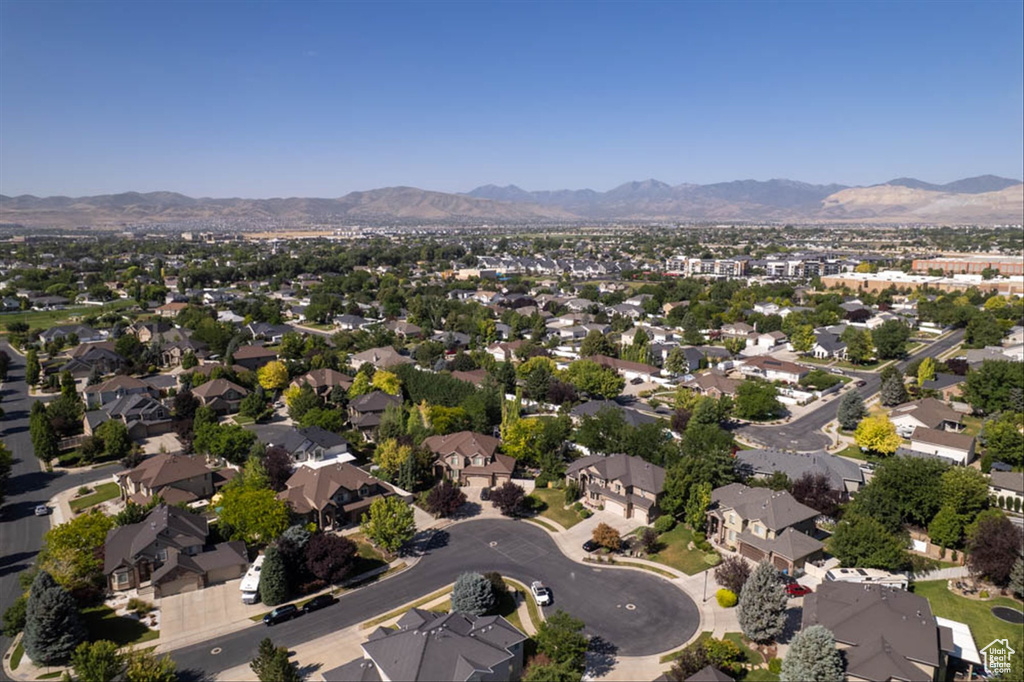 Aerial view of property\'s location with a mountainous background and nearby suburban area