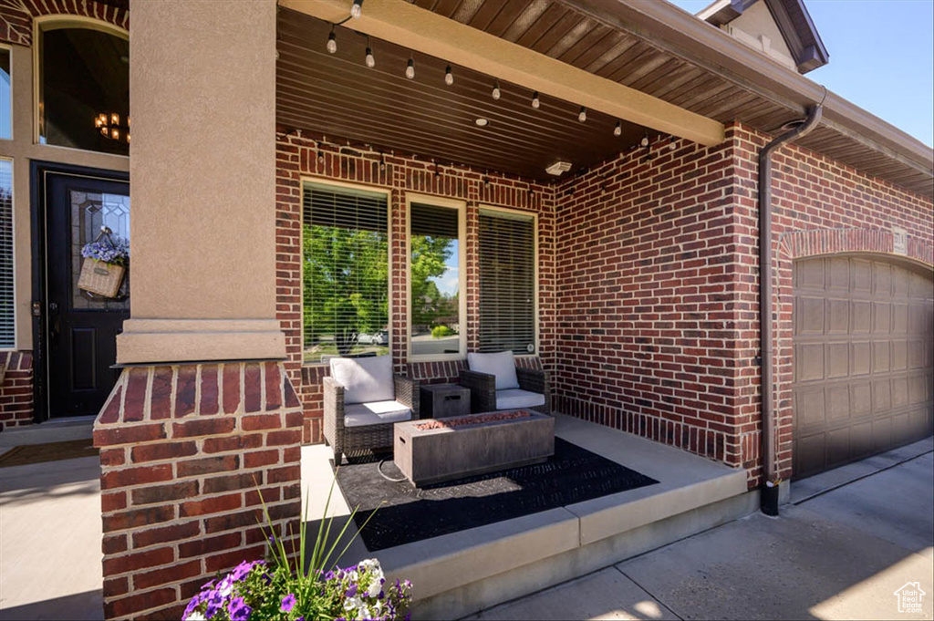 View of patio featuring an attached garage