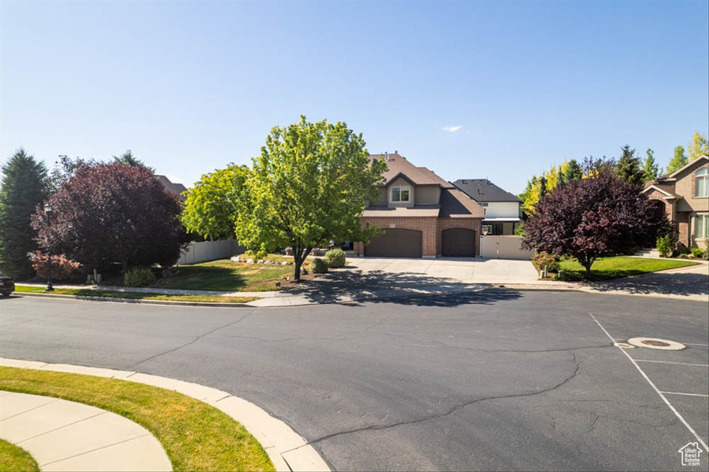 View of asphalt road with sidewalks and curbs