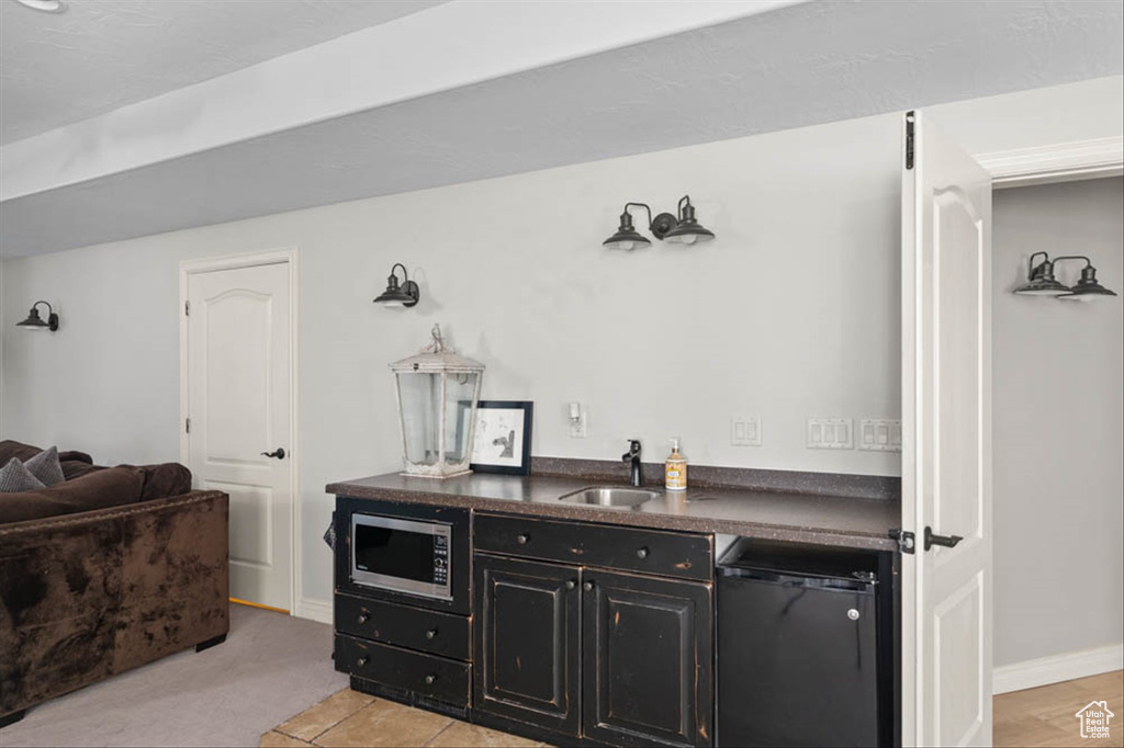 Indoor wet bar with stainless steel microwave and dishwashing machine