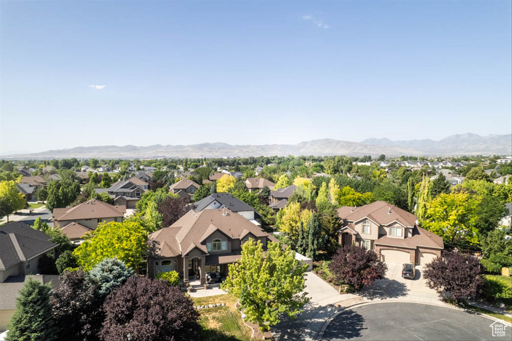 Aerial view of residential area with a mountainous background