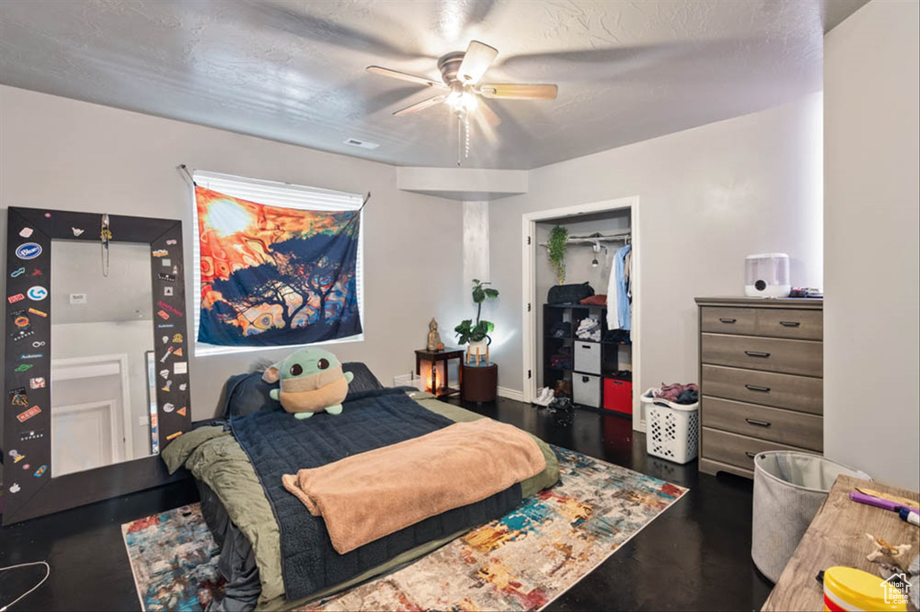 Bedroom with a closet and a ceiling fan