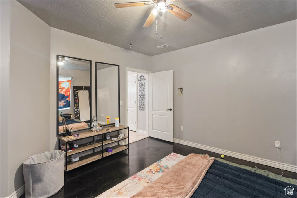 Bedroom featuring baseboards and a ceiling fan