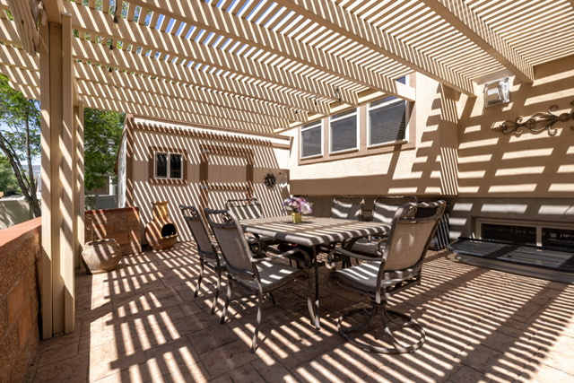 View of patio / terrace featuring outdoor dining space and a pergola