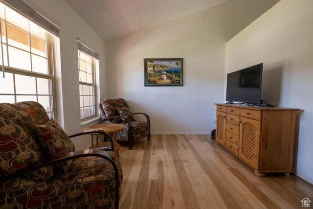 Sitting room featuring light wood-style flooring and baseboards