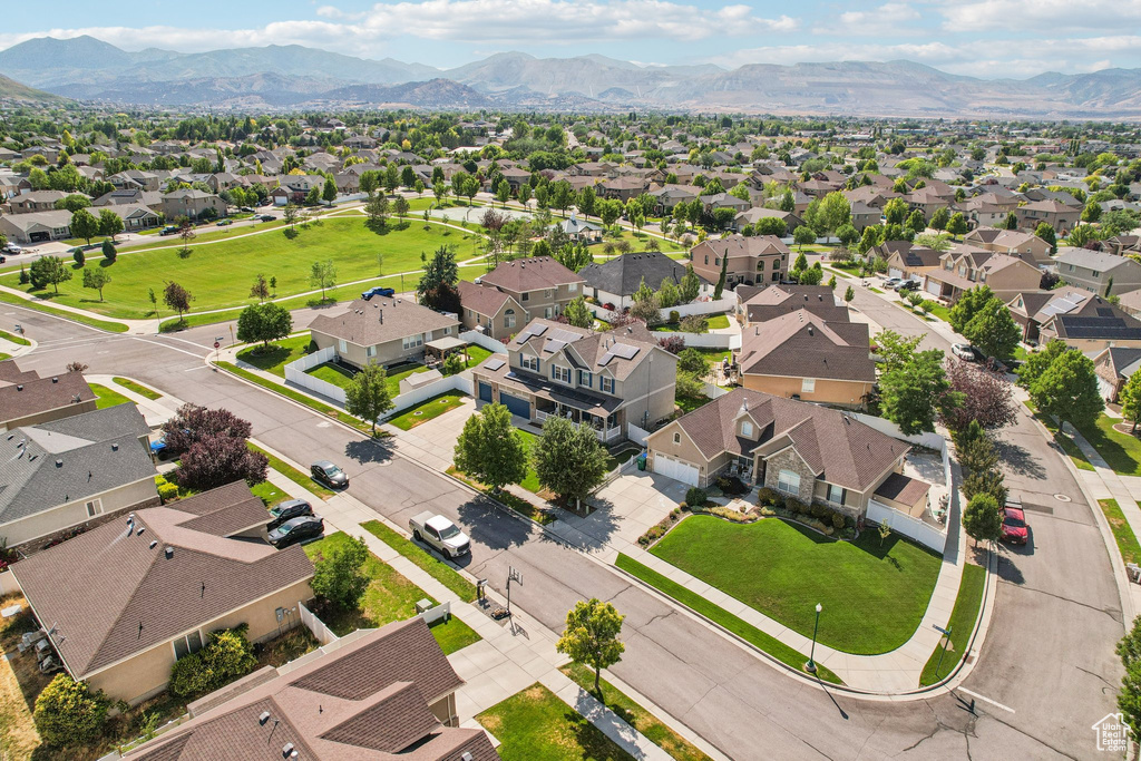 Aerial perspective of suburban area with a mountain backdrop