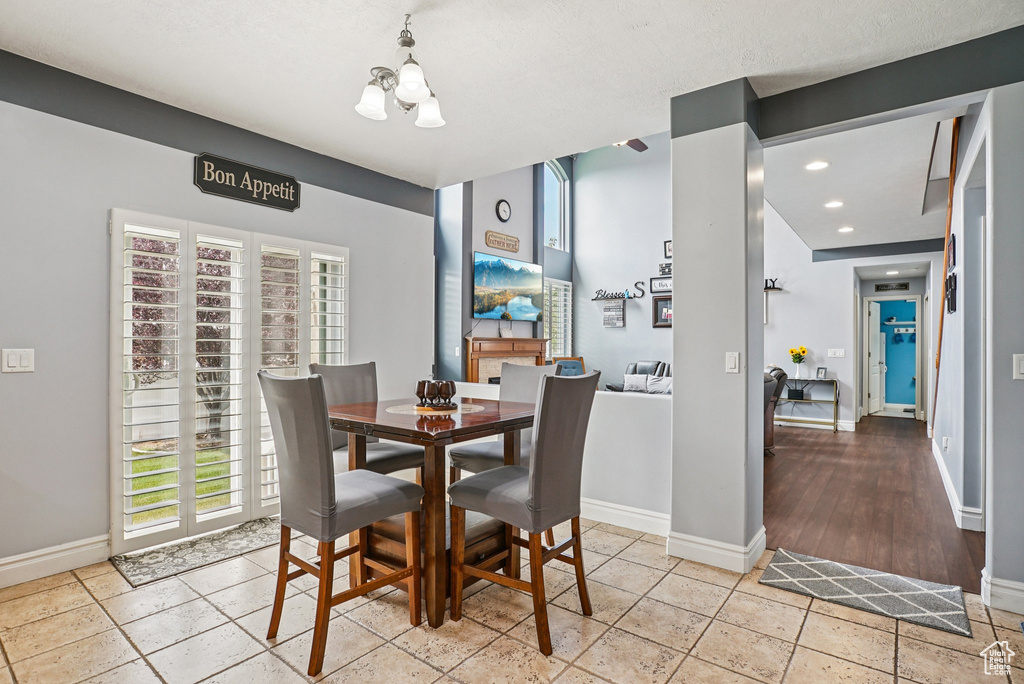Dining room featuring a chandelier and recessed lighting