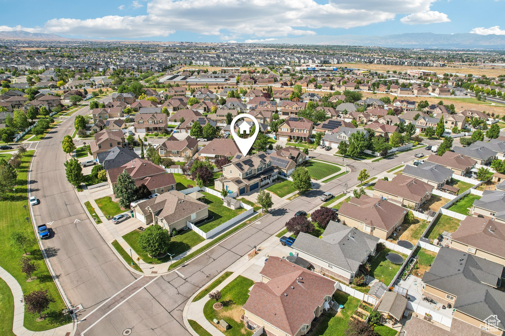 Aerial view of property and surrounding area with nearby suburban area