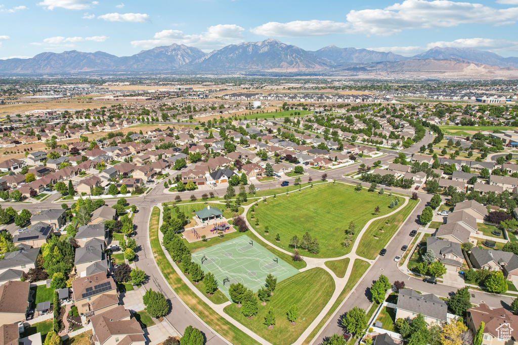 Aerial overview of property\'s location with a mountain backdrop and nearby suburban area