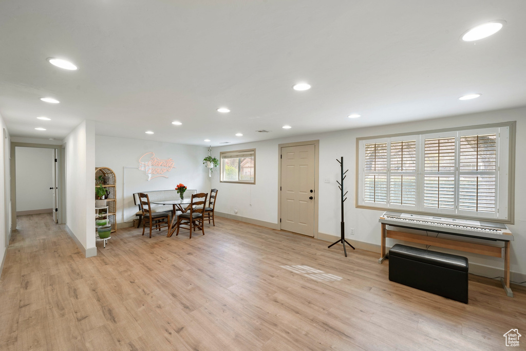 Dining area with recessed lighting and wood finished floors