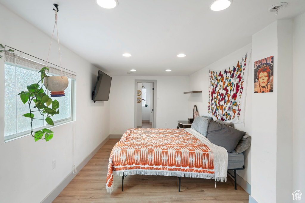 Bedroom with recessed lighting and light wood-style flooring