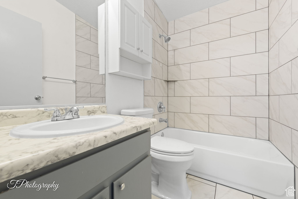 Full bath featuring vanity and shower / bath combination
