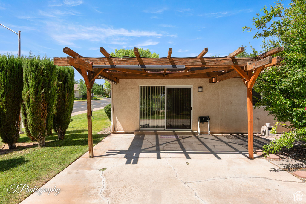 View of patio with a pergola
