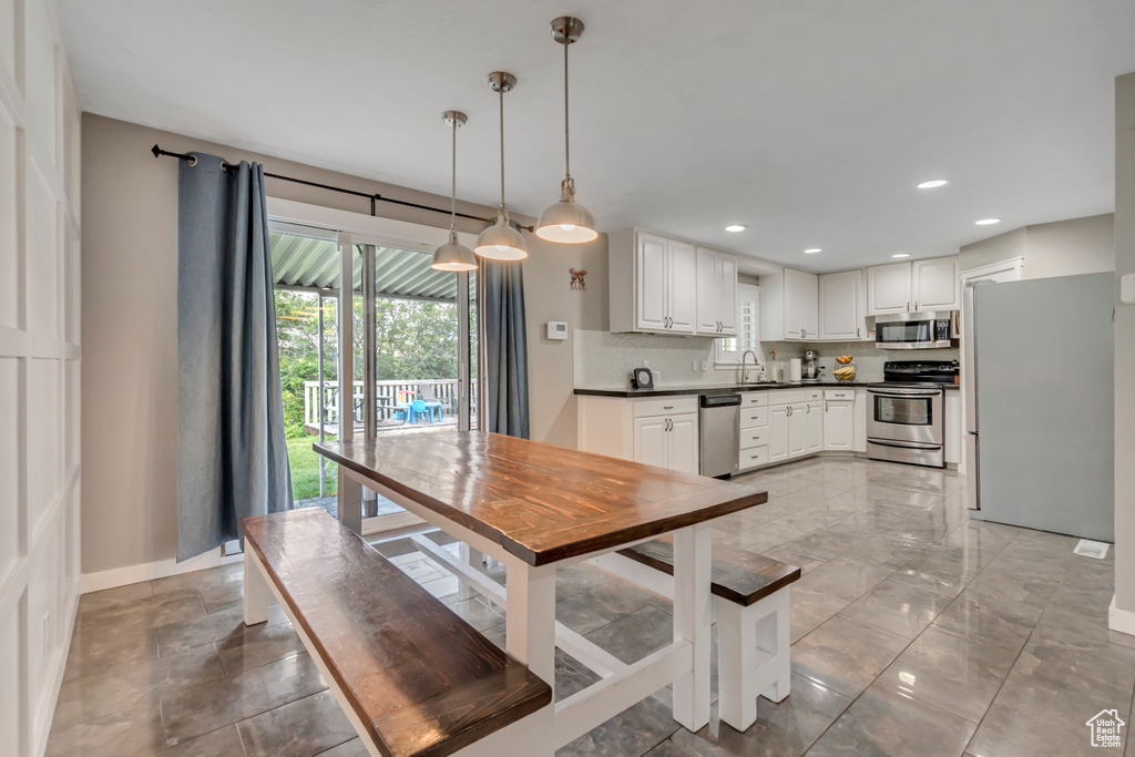 Dining room featuring baseboards and recessed lighting