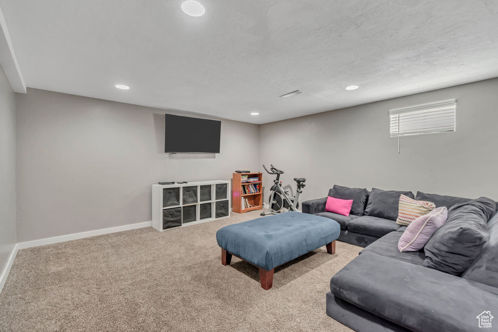 Living room featuring recessed lighting and carpet floors