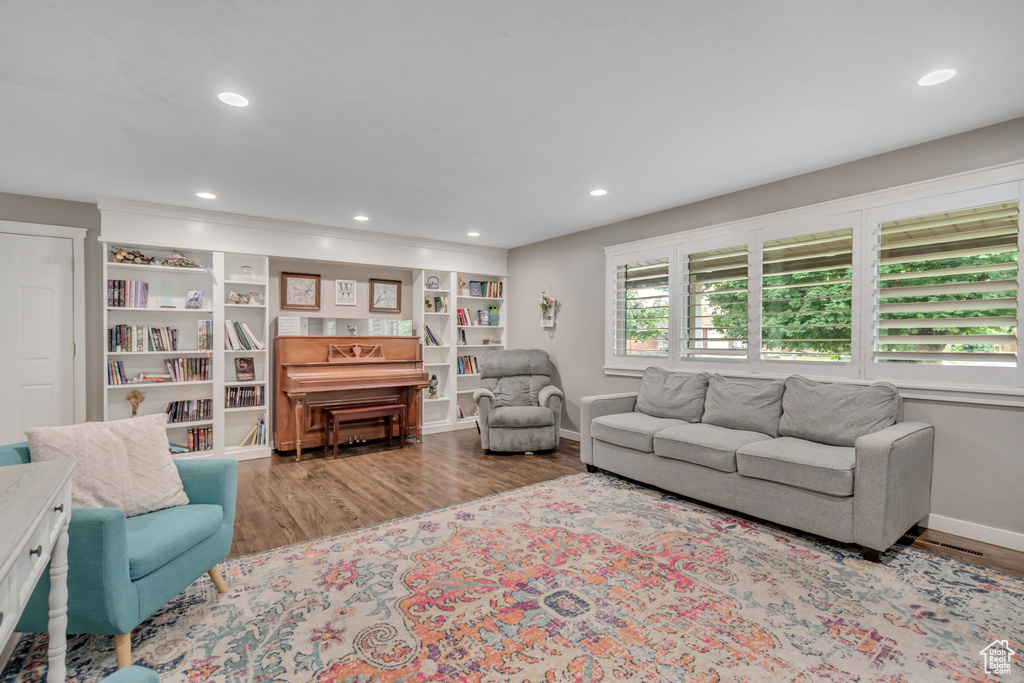 Living room with wood finished floors and recessed lighting