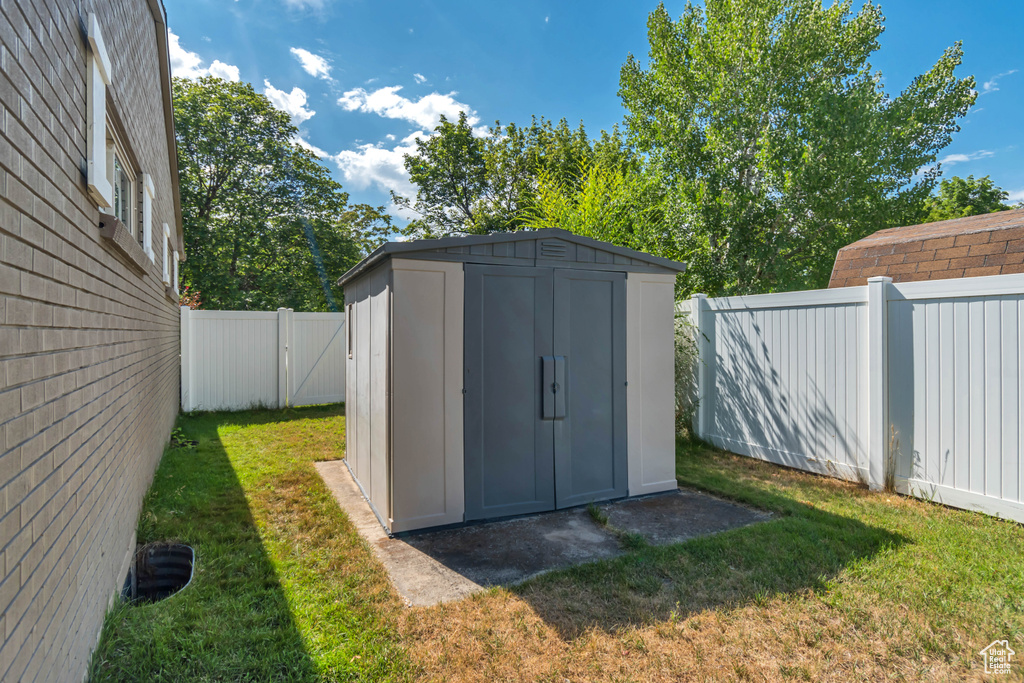 View of shed featuring a fenced backyard