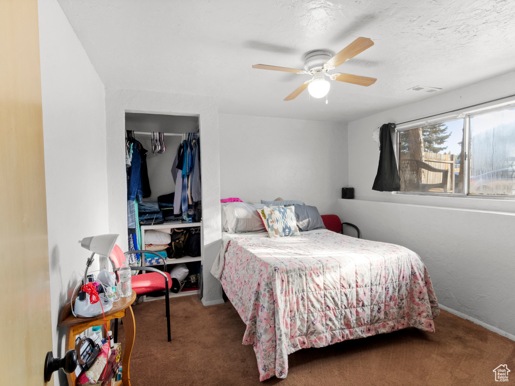 Bedroom featuring carpet flooring and ceiling fan