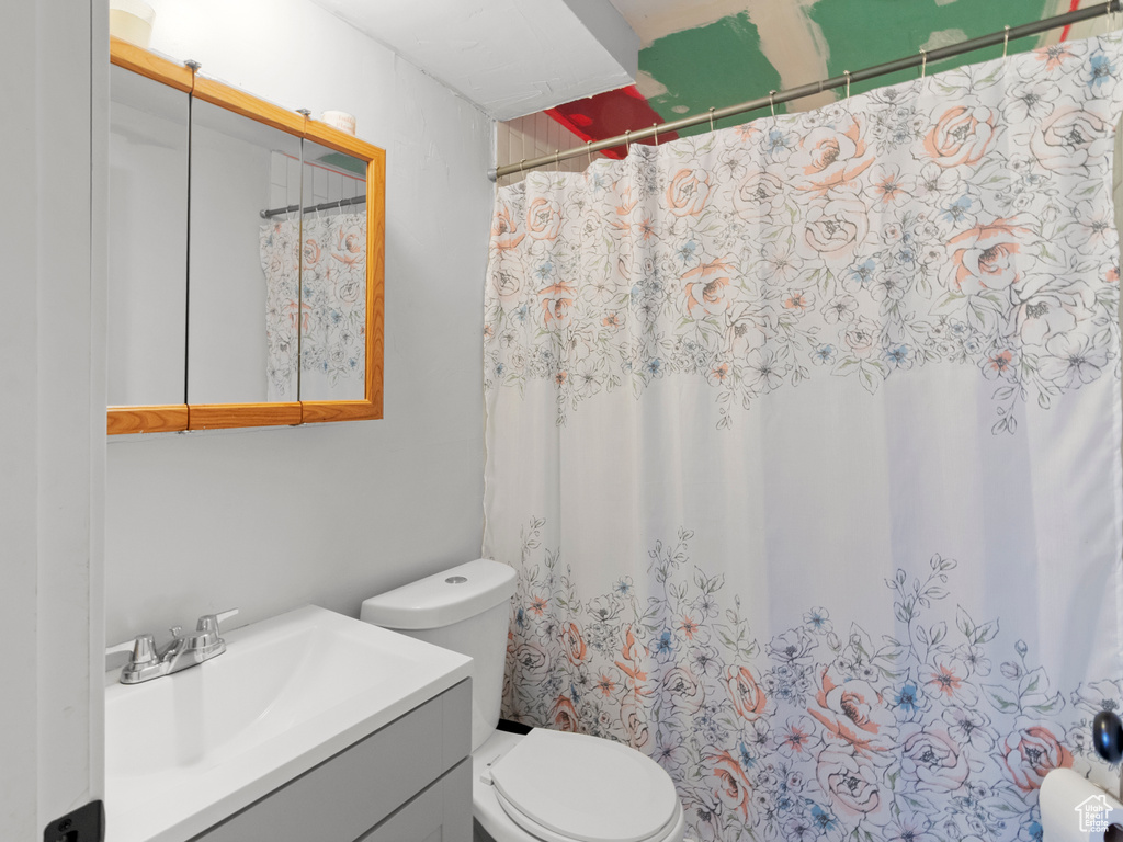 Bathroom featuring vanity and a shower with curtain