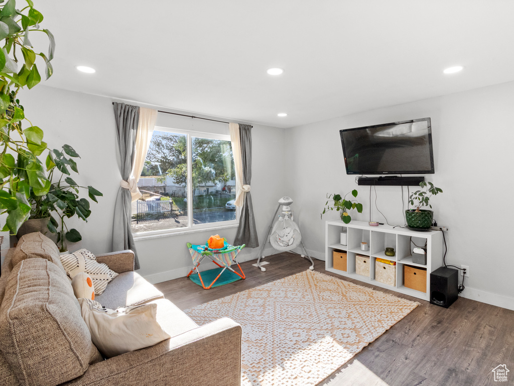 Living area with recessed lighting and wood finished floors