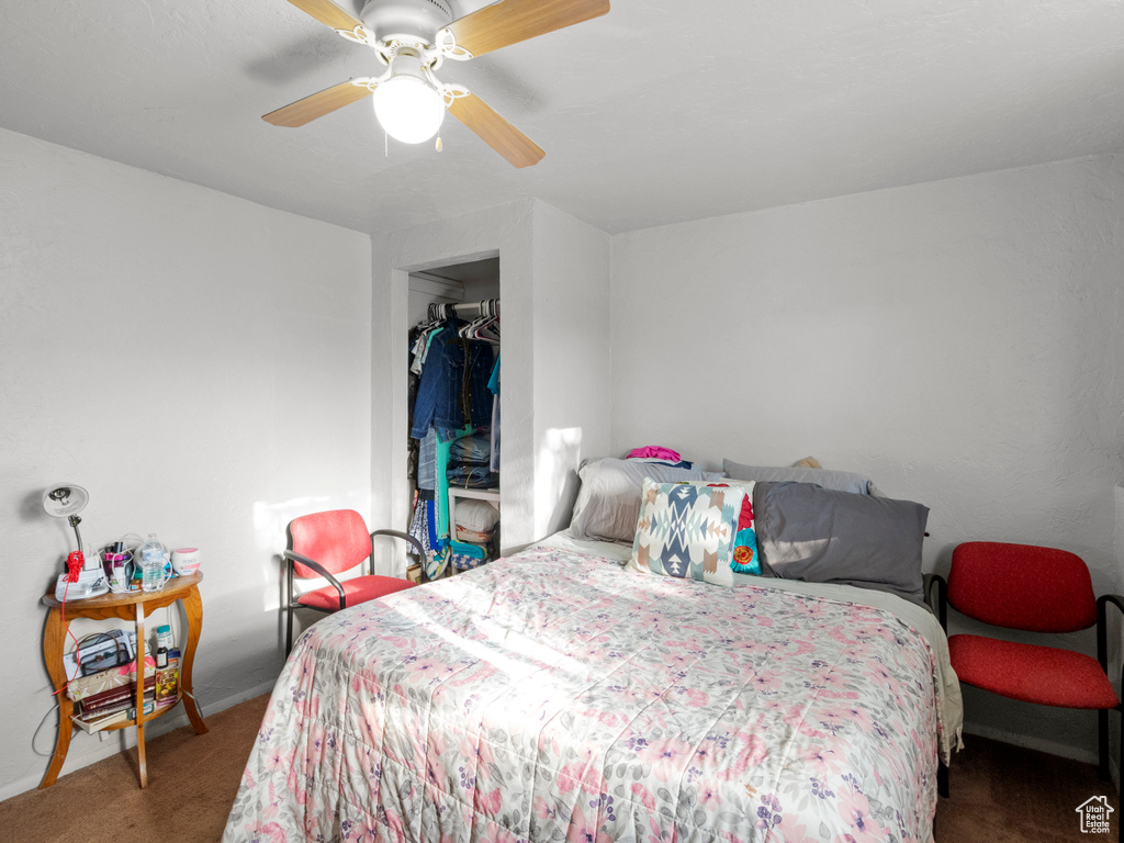 Bedroom with carpet flooring and a ceiling fan