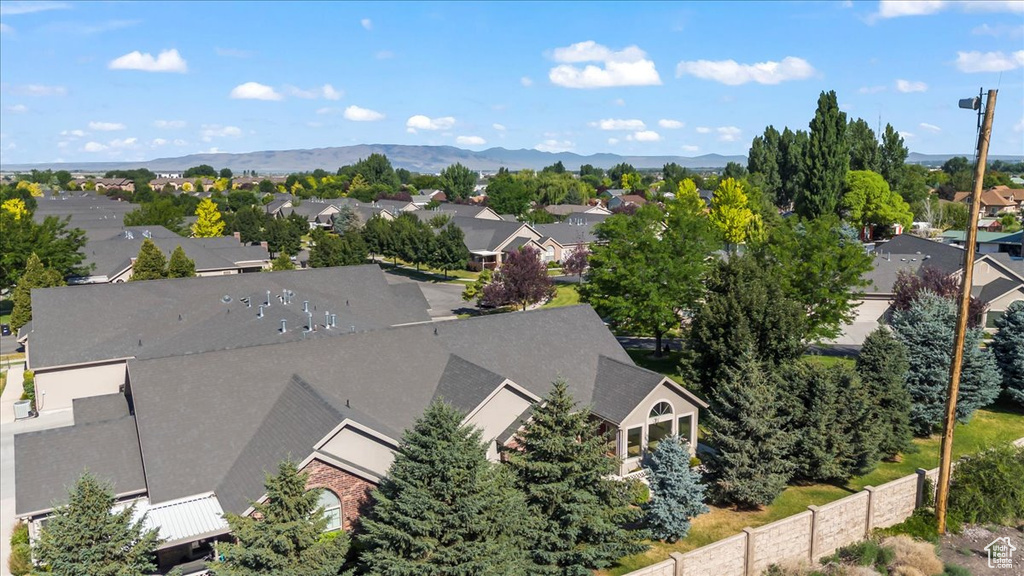 Aerial perspective of suburban area featuring a mountain backdrop