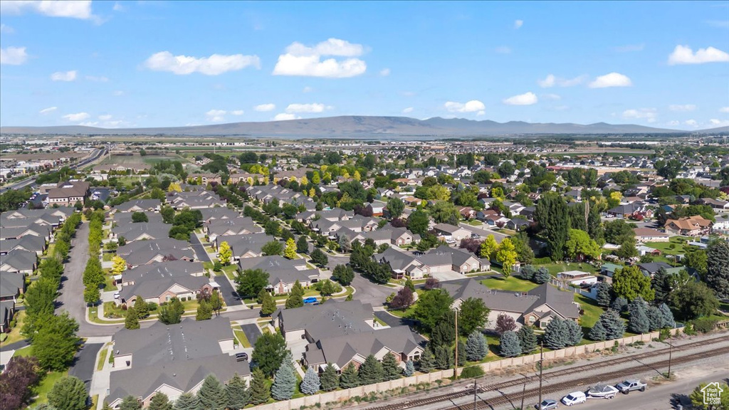 Aerial overview of property\'s location featuring nearby suburban area and mountains