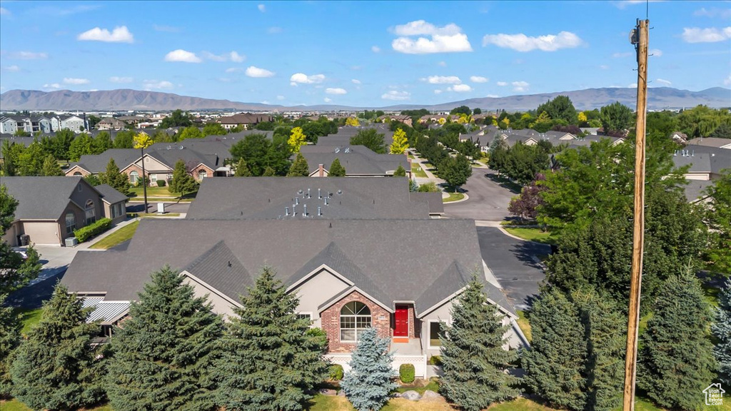 Aerial perspective of suburban area with a mountainous background