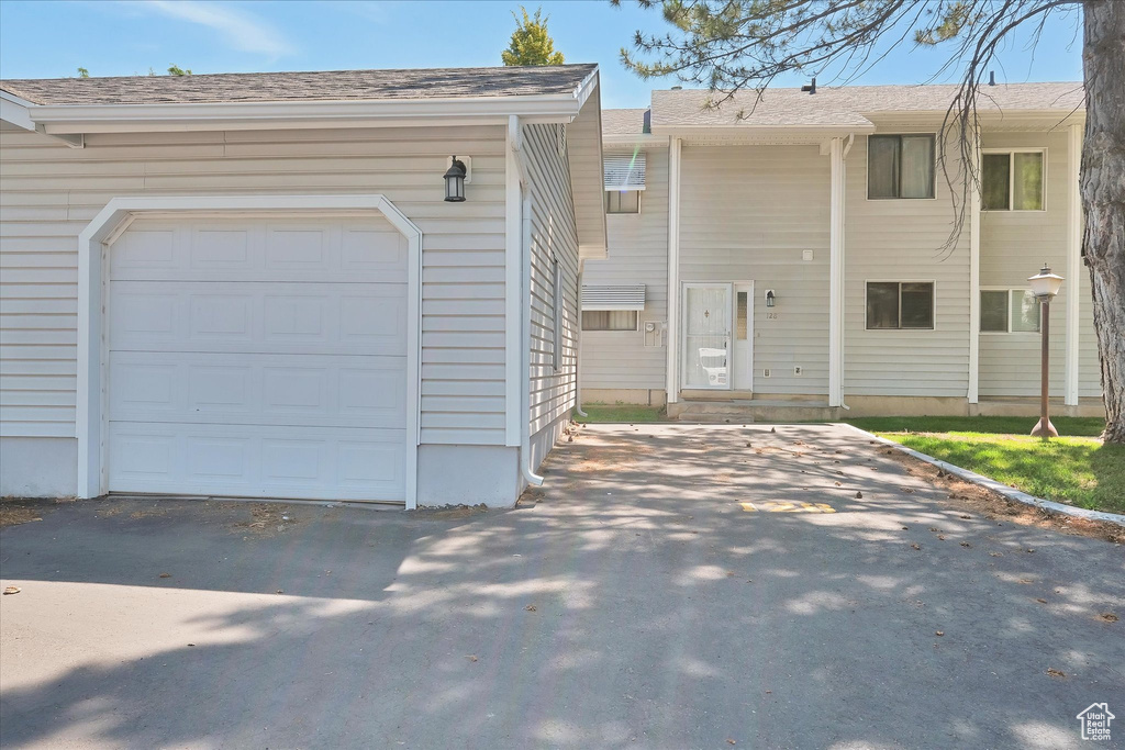 View of property featuring a garage