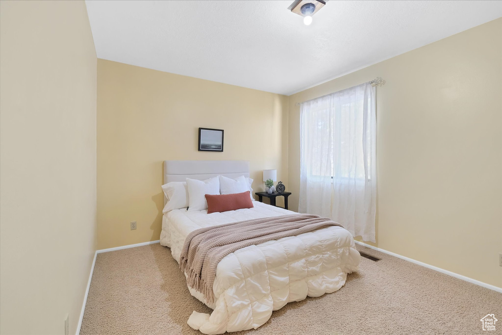 Bedroom with carpet and baseboards