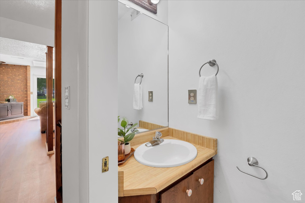 Bathroom with vanity and a textured ceiling