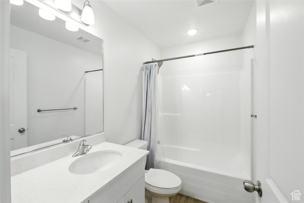 Full bathroom featuring vanity and shower / tub combo with curtain