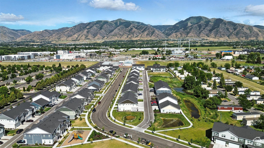 View of property location with mountains and nearby suburban area