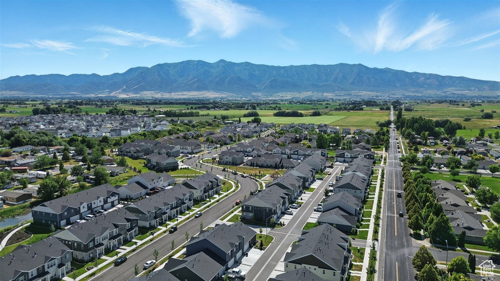 Aerial view of residential area featuring a mountain backdrop
