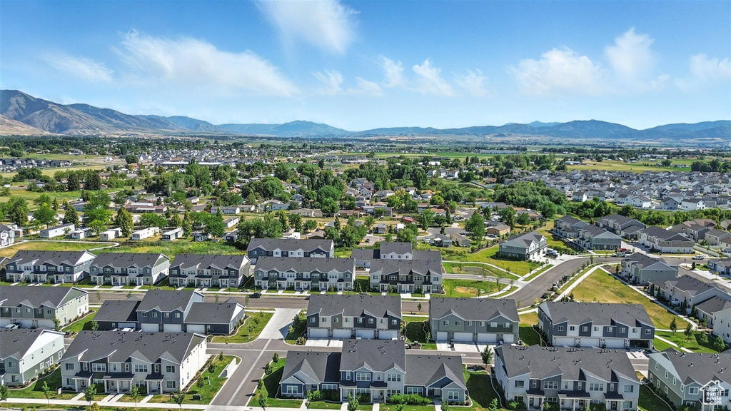 Aerial perspective of suburban area with a mountain backdrop