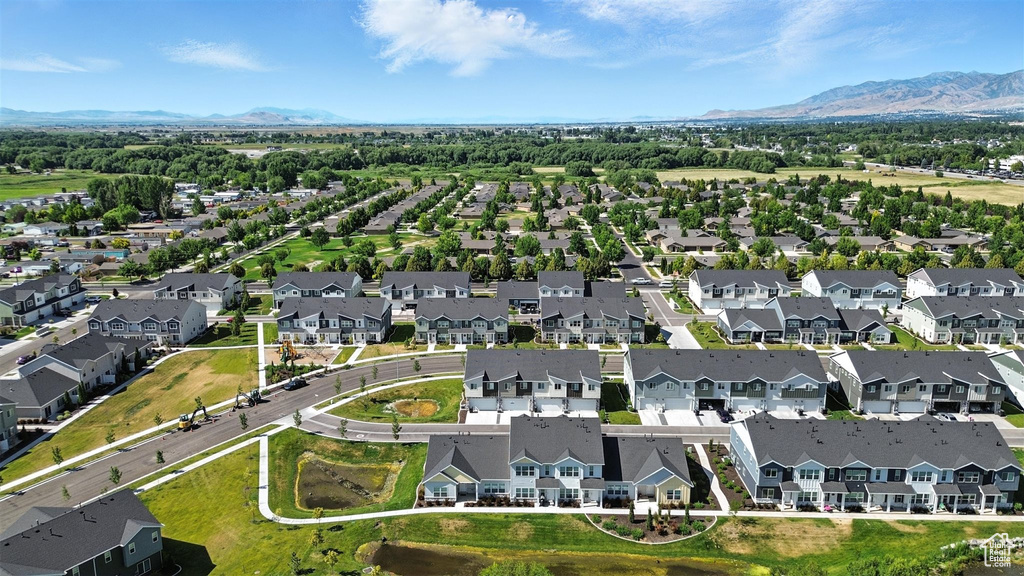 Aerial perspective of suburban area featuring a mountain backdrop