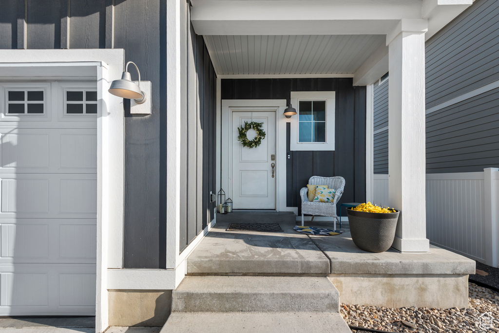 View of exterior entry with a porch