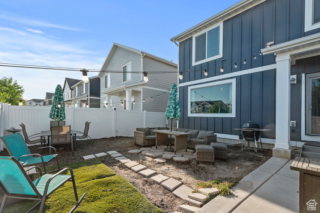 View of patio featuring outdoor lounge area, area for grilling, and outdoor dining area