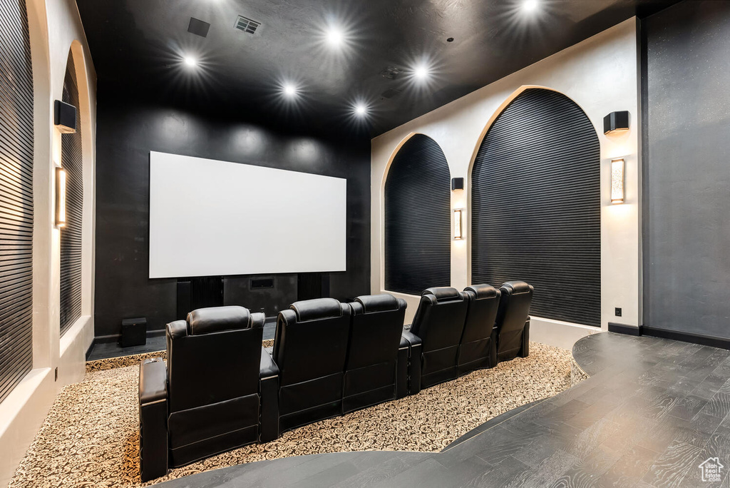 Home theater with recessed lighting and wood finished floors