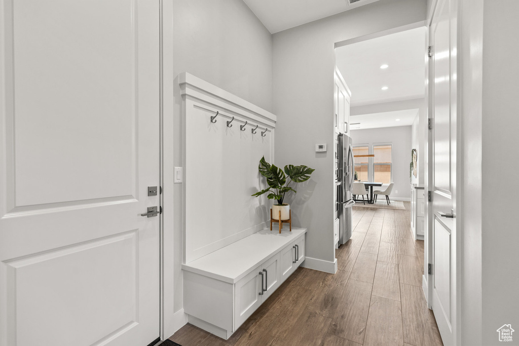 Mudroom with wood finished floors and recessed lighting