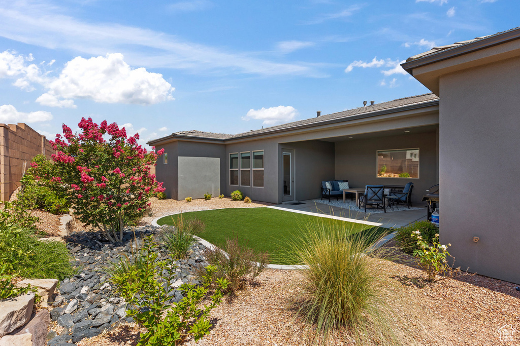 View of yard with a patio area and outdoor lounge area