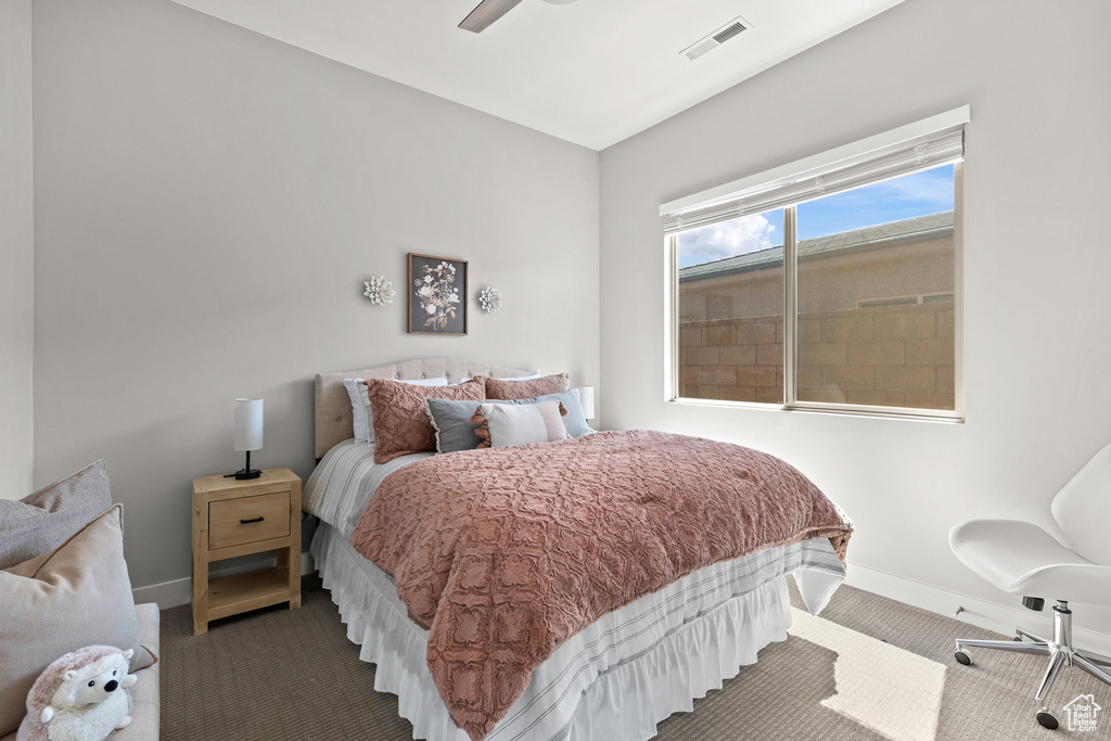 Bedroom with carpet and ceiling fan