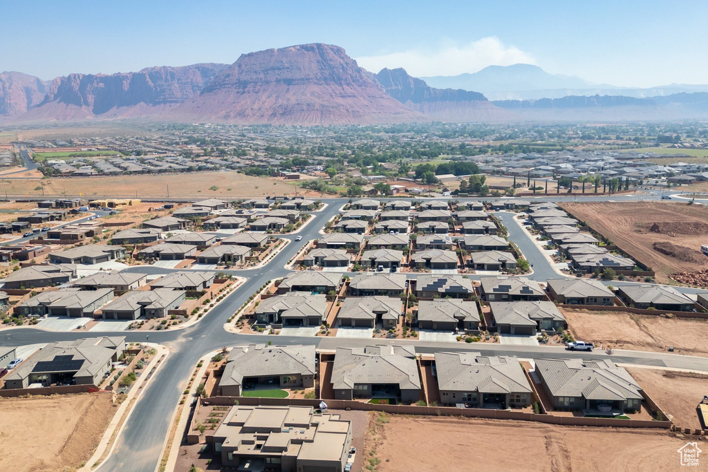 Aerial perspective of suburban area with a mountainous background